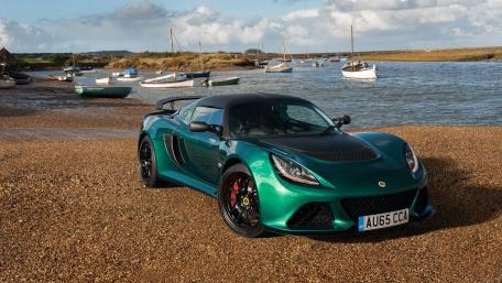 Sleek Lotus Car by the Scenic Shoreline wallpaper
