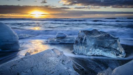 Ethereal Ice and Ocean Sunrise Scene wallpaper