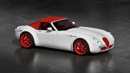 Sleek White Sports Car with Red Accents and Convertible Top wallpaper