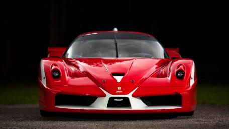 Red Ferrari Supercar Majestic and Powerful Performance wallpaper
