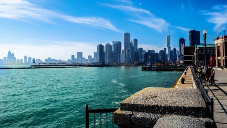 Vibrant City Skyline Over Serene Waterway wallpaper