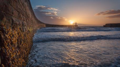 Serene Sunset by the Lighthouse wallpaper