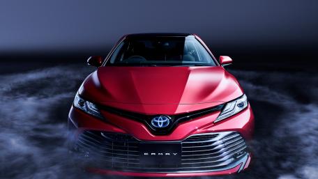Sleek Red Toyota Camry in Dramatic Lighting wallpaper