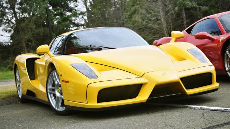 Vibrant Yellow Supercar Showcased in Nature's Beauty wallpaper