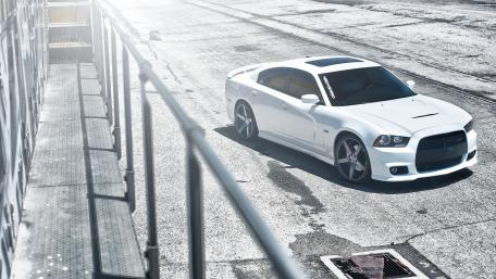 Sleek White Sports Car on Urban Track wallpaper