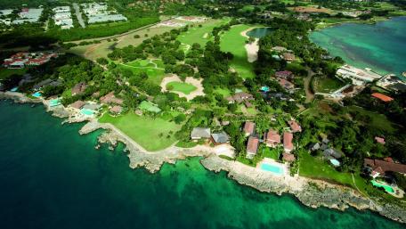 Serene Coastal Retreat Amidst Lush Greenery wallpaper