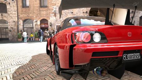 Dynamic Red Car in Historic Setting wallpaper