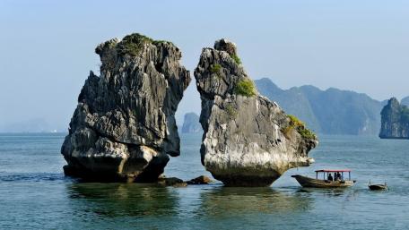 Majestic Rock Formation by Tranquil Waters wallpaper