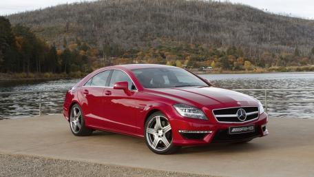 Sleek Red Mercedes in Nature's Embrace wallpaper