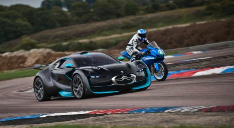Futuristic Car and Motorcycle Racing on Track wallpaper