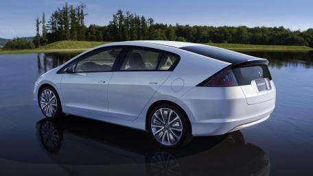 Sleek Modern Car Reflections in Nature's Mirror wallpaper