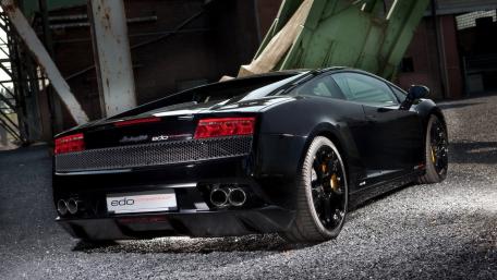 Sleek Black Lamborghini in Urban Setting wallpaper