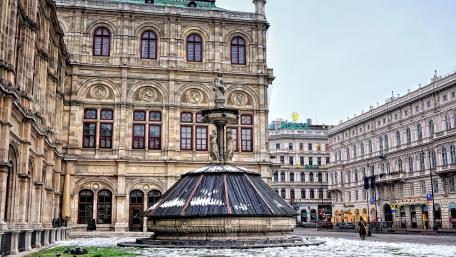 Historic Vienna Square with Elegant Architecture and Fountain wallpaper