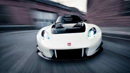 Dynamic White Sports Car in Motion wallpaper