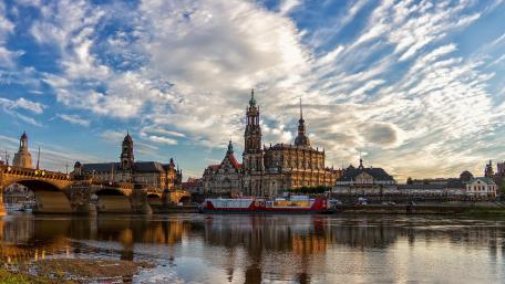 Serene Cityscape Reflected in Tranquil Waters wallpaper