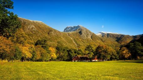 Majestic Mountains Under a Clear Blue Sky wallpaper