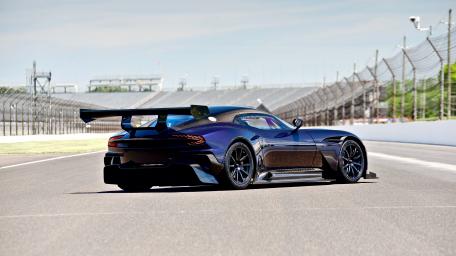 Sleek Aston Martin Racing on the Track wallpaper