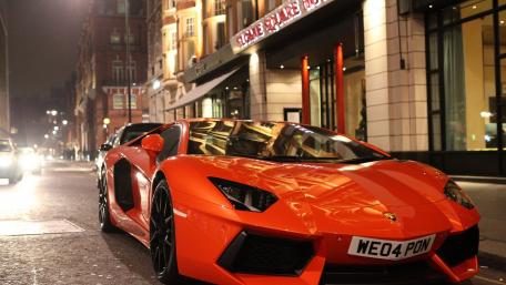 Vibrant Night Drive with a Luxury Sports Car wallpaper