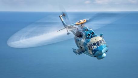 Dynamic Helicopter in Flight Over Ocean Views wallpaper