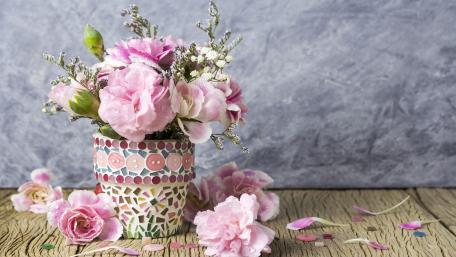 Elegant Flower Arrangement in Colorful Pot for a Serene Atmosphere wallpaper