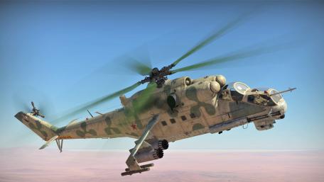 Military Helicopter in Action Over Desert Landscape wallpaper