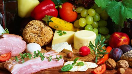 Vibrant Fresh Produce and Cheeses Displayed Together wallpaper