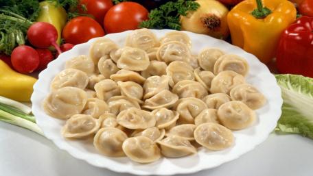 Delicious Dumplings Surrounded by Fresh Vegetables wallpaper