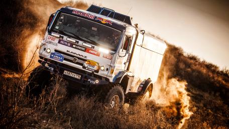 Thrilling Off-Road Adventure with Red Bull Truck wallpaper