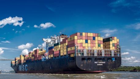Majestic Cargo Ship in Clear Blue Sky wallpaper