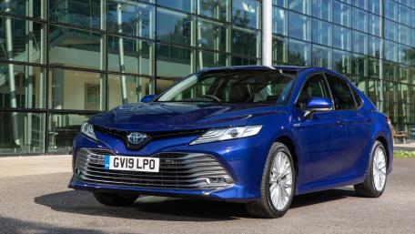 Sleek Blue Toyota Camry in a Modern Setting wallpaper