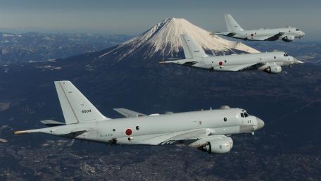Majestic Military Flight Over Majestic Peak wallpaper