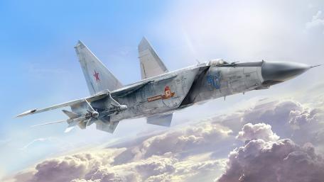 Sleek Fighter Jet Soaring Through the Clouds wallpaper