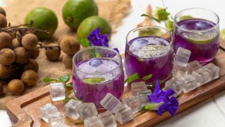 Vibrant Purple Drinks on a Rustic Tray wallpaper