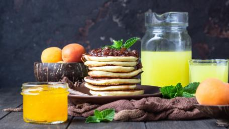 Delicious Pancakes with Fresh Ingredients and Refreshing Drinks wallpaper