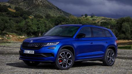 Sleek Blue SUV Against a Dramatic Landscape wallpaper