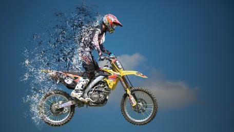 Dynamic Motorcycle Ride Above the Clouds wallpaper