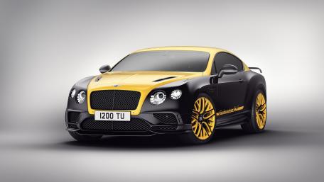Sleek Black and Yellow Luxury Coupe Wallpaper wallpaper