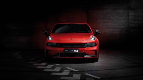 Sleek Red Car in Dramatic Lighting wallpaper