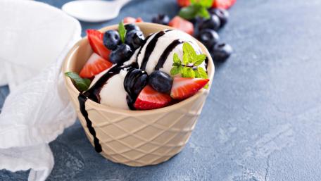 Delicious Ice Cream with Fresh Fruits and Chocolate Sauce wallpaper