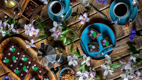 Delightful Chocolate Treats Surrounded by Blossoms wallpaper