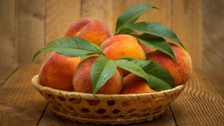 Fresh and Juicy Peaches in a Basket wallpaper