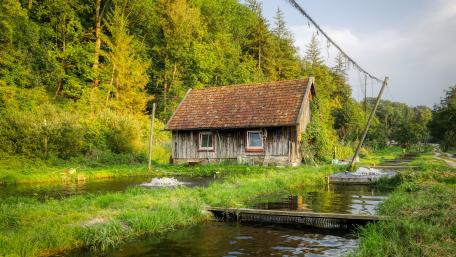 Charming Wooden Cottage by the Canal wallpaper