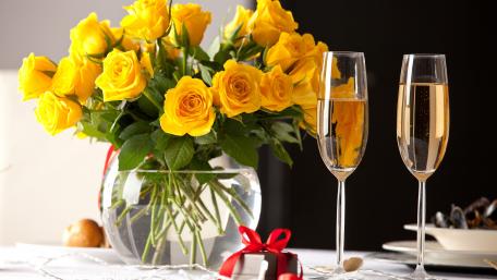 Romantic Evening with Yellow Roses and Champagne wallpaper