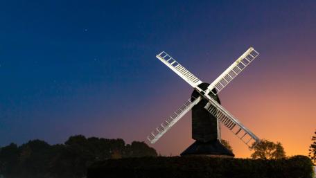 Serene Windmill Under a Starry Sky wallpaper