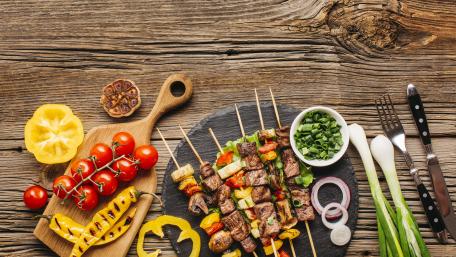 Delicious Grilled Skewers on Wooden Planks wallpaper