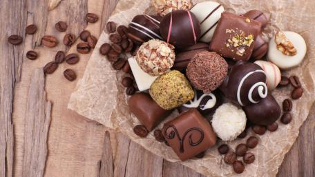 Delicious Assortment of Chocolates and Coffee Beans wallpaper