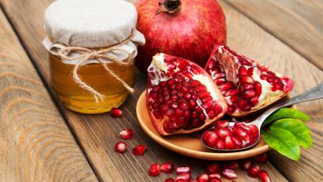 Juicy Pomegranate and Sweet Honey Delight wallpaper