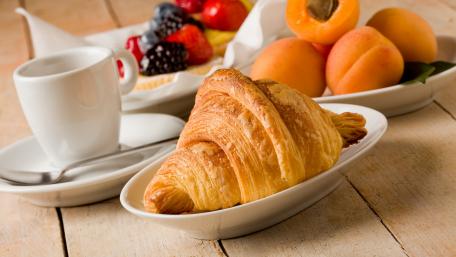 Delicious Croissant and Fresh Fruits Breakfast Delight wallpaper