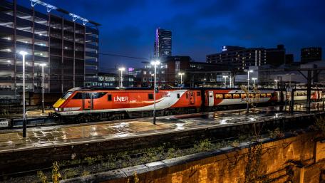 Urban Nightscape with a Train in Motion wallpaper