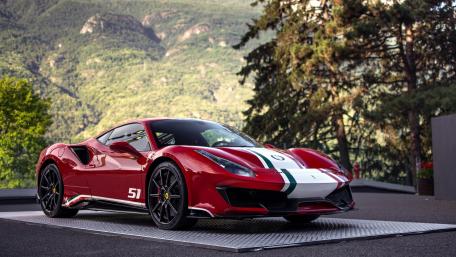 Elegant Red Sports Car in Scenic Mountain Landscape wallpaper